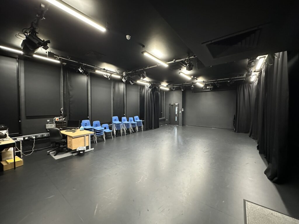 Black box theatre style drama classroom with professional lighting