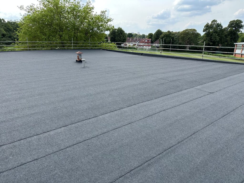 School Condition Allocation - newly installed flat roof with safety railing, improving building condition and longevity.