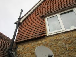 Damaged school roof tiles identified during condition survey before CIF-funded roof replacement project.