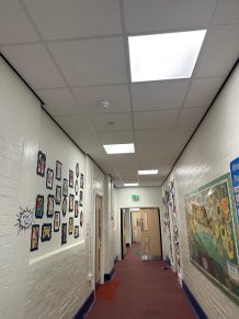 CIF-funded school refurbishment with upgraded LED lighting and suspended ceiling for energy efficiency and improved learning environment.