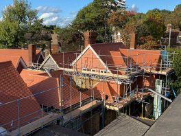 Multiple pitched clay-tiled roofs under CIF renovation