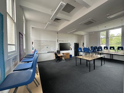 Bright classroom with interactive whiteboard and new furniture