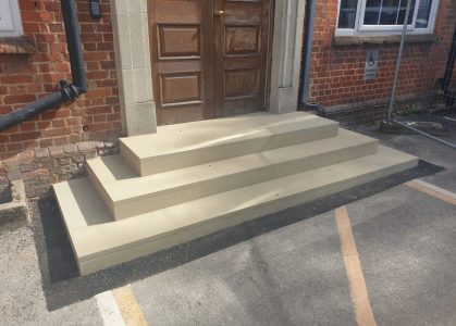Newly installed stone entrance steps as part of CIF-funded school accessibility and refurbishment project.