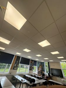 Refurbished school classroom with new suspended ceiling and LED lighting installed through CIF-funded project.