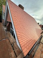 Completed school roof replacement with new red tiles installed through CIF-funded refurbishment project.
