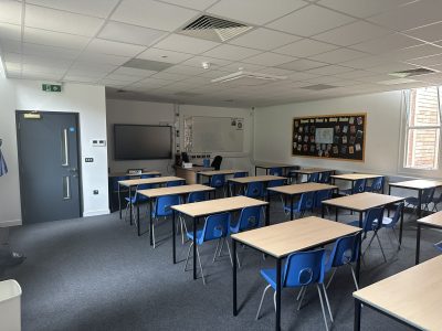 Modern classroom with display boards and interactive screen