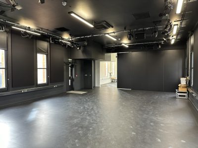Specialist drama studio at Fort Pitt Grammar School with theatrical lighting rigs, blackout blinds and performance-ready interior.