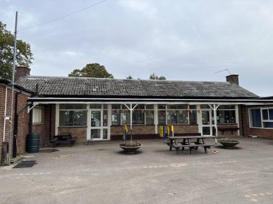 Knaphill Lower Primary School - Case Study - School building with outdated roof requiring refurbishment and investment for improved safety and efficiency.